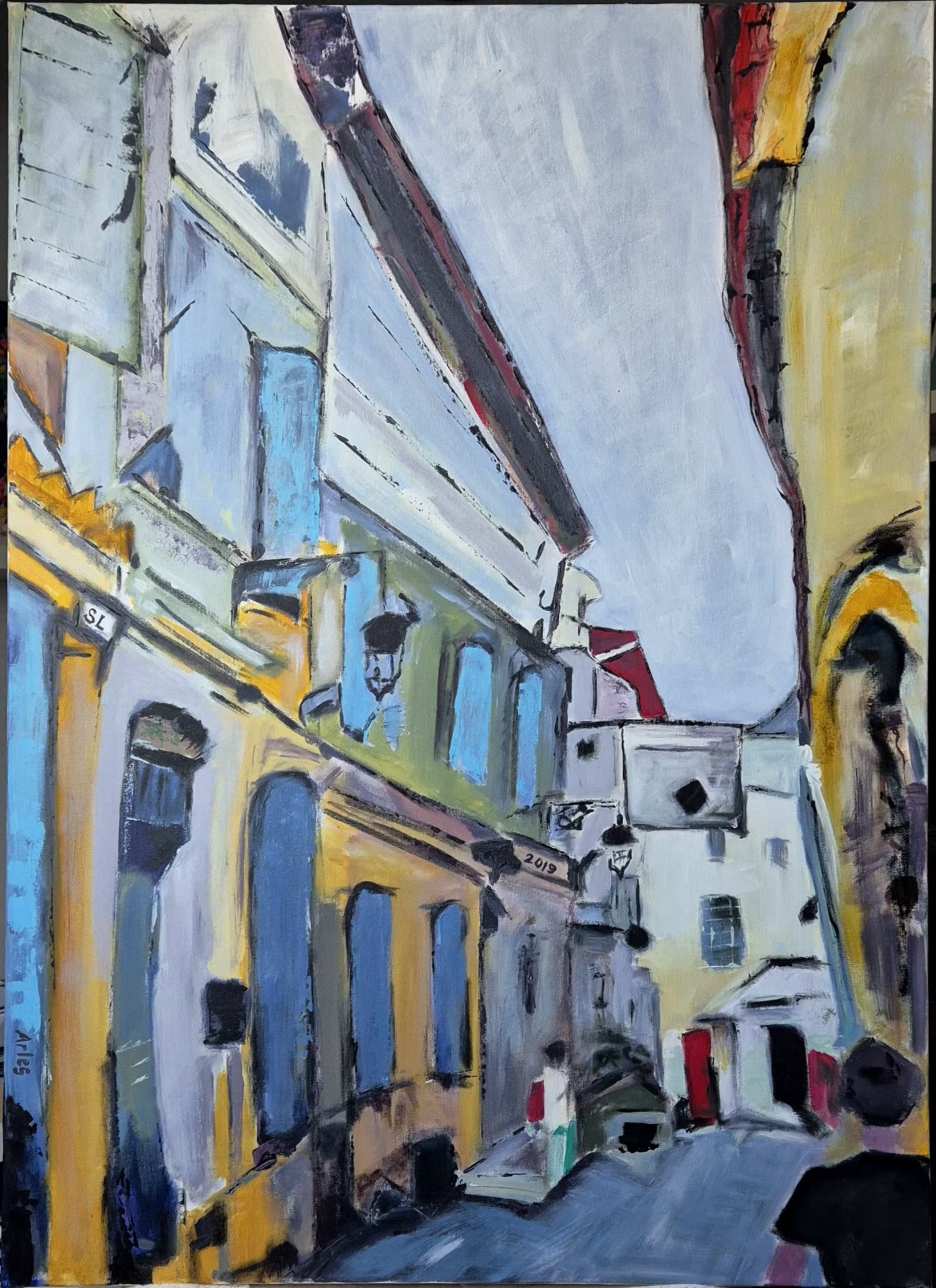 Painting of a narrow street in Arles with pale buildings, blue shutters and warm yellow details